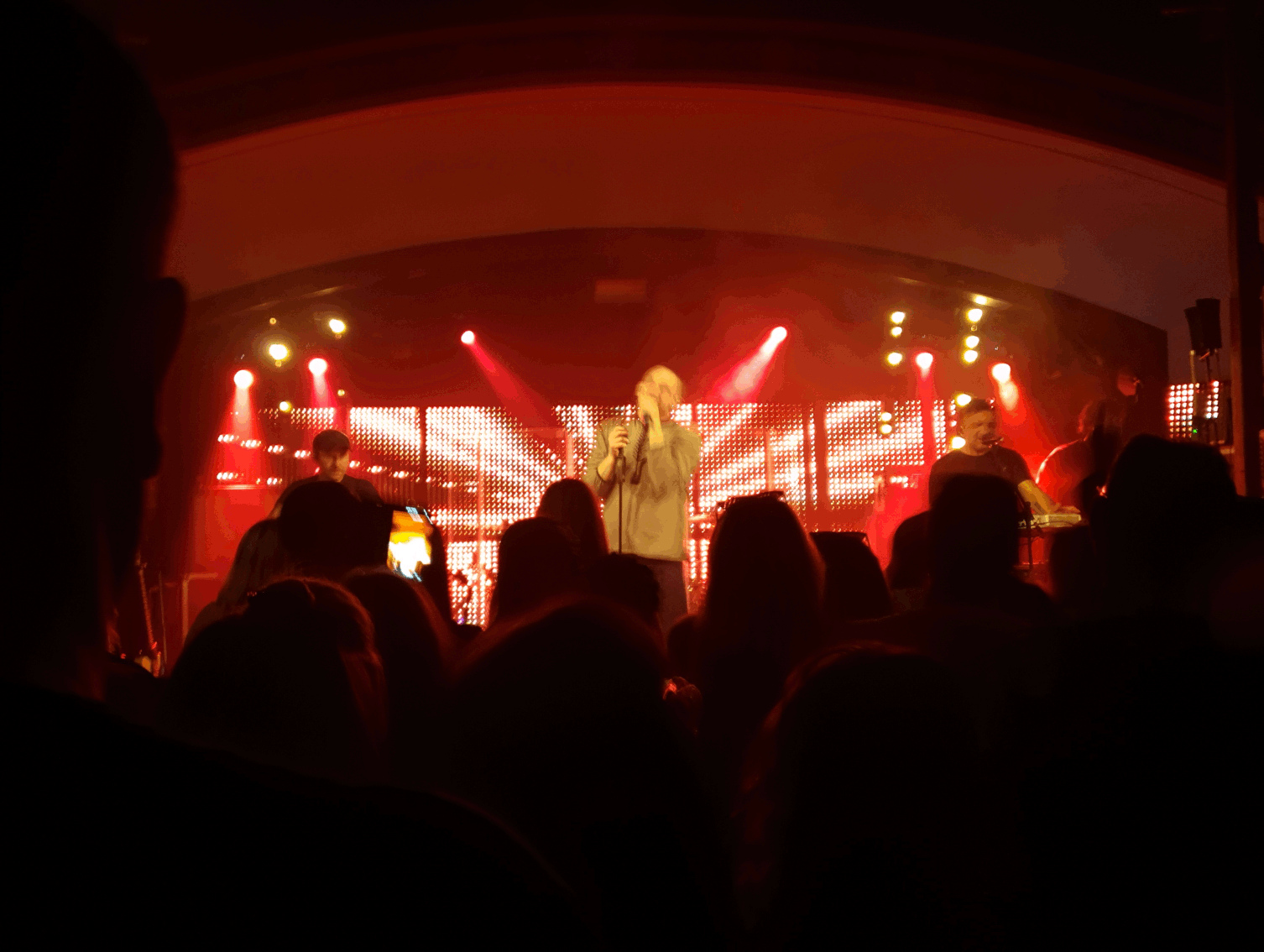 image of the ukranian band druga rika on stage surrounded by red lighting